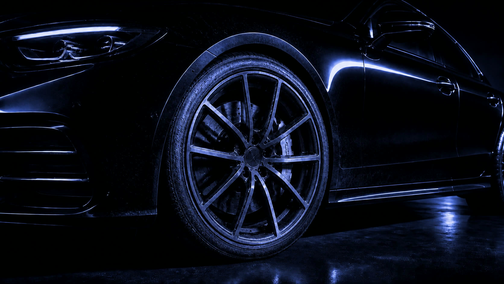 An alloy wheel loaded with baked-on brake dust and road grime.